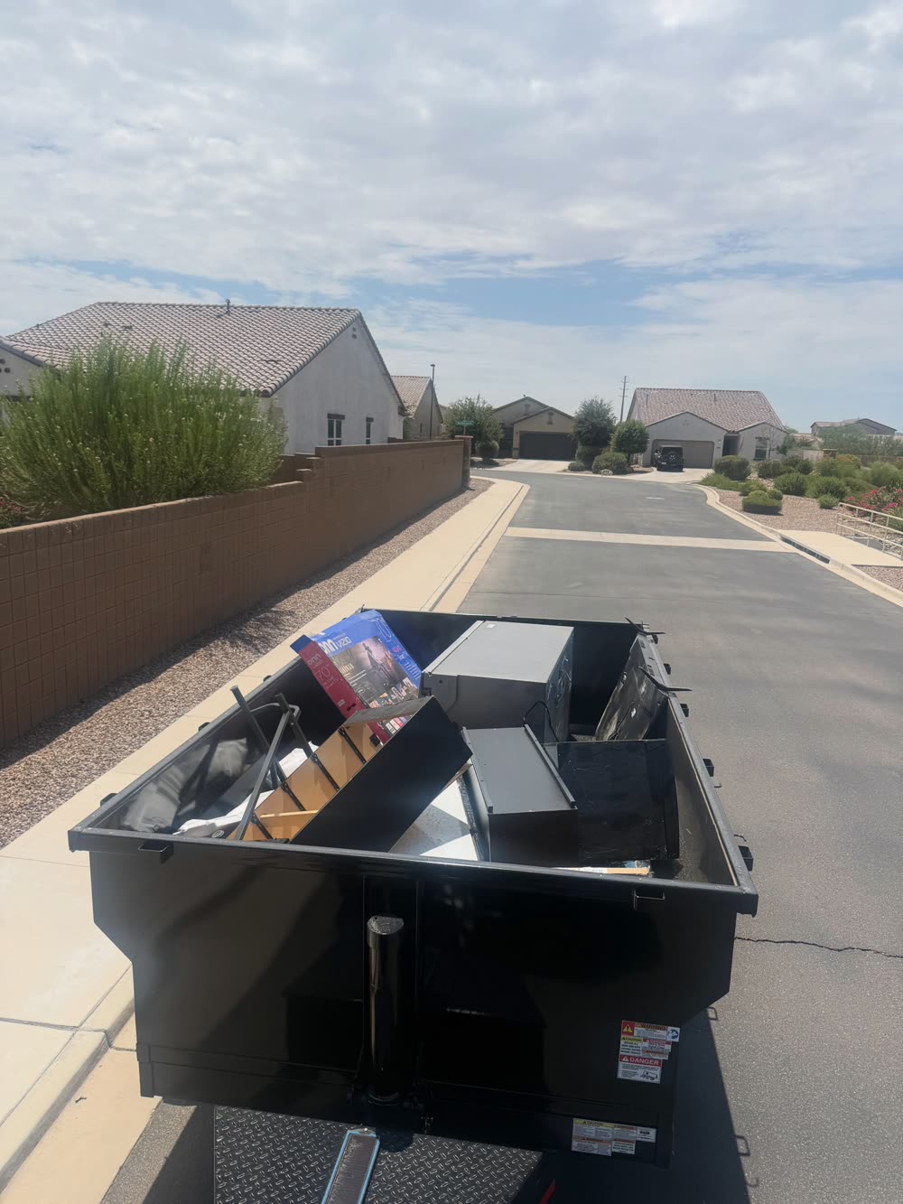 EJ's loaded trailer heading out of a San Tan Valley neighborhood